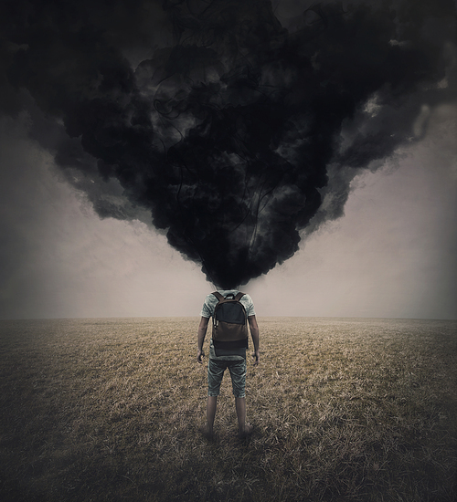 Surreal scene of a lone man in the field with dense black smoke instead his head. Fatigue and annoyed person suffering emotional crisis. Mental burnout and explosion. Depression and despair concept