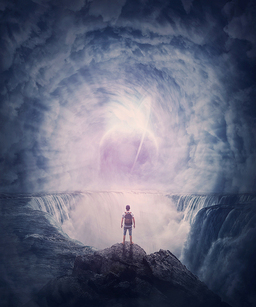 Person stands on the edge of a cliff above a waterfall looking at a huge whirlwind in the clouds that creates a portal to another planet. Surreal and fantasy scene, magical world adventure concept