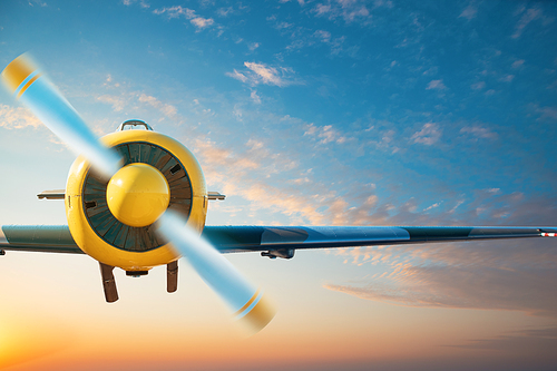 Small aircraft flying above in the blue sunset sky