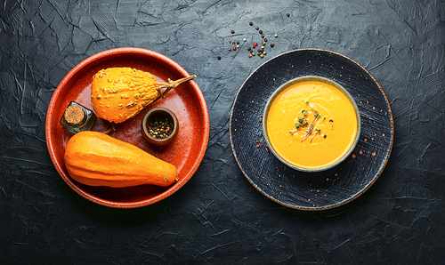 Vegetarian pumpkin cream soup.Bowl of autumn vegan pumpkin soup.Vegetable cream soup