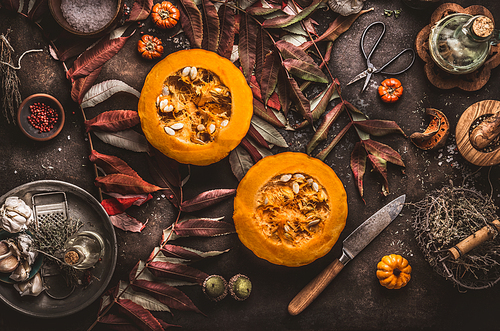 Autumn, seasonal ,food, background ,halved ,pumpkin, knife , herbs ,spices ,dark ,rustic ,background ,fall, leaves, Top view, Border