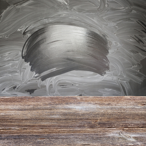 School desk - empty balckboard with chalk and wet traces background