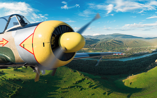 Small aircraft flying above in the blue sunset sky