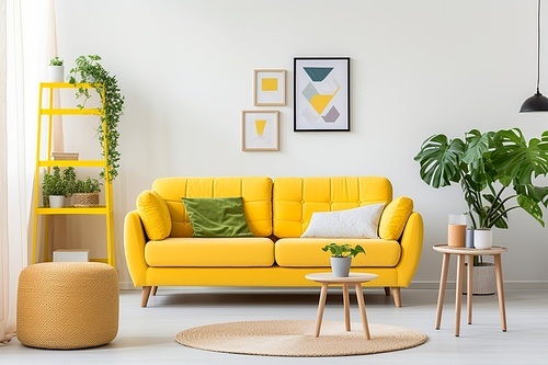 Scandinavian interior design of modern living room, home. Vibrant yellow sofa, knitted pouf and shelf.