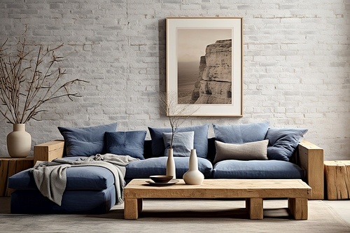 Rustic coffee table near blue sofa against brick wall. Farmhouse home interior design of modern living room.