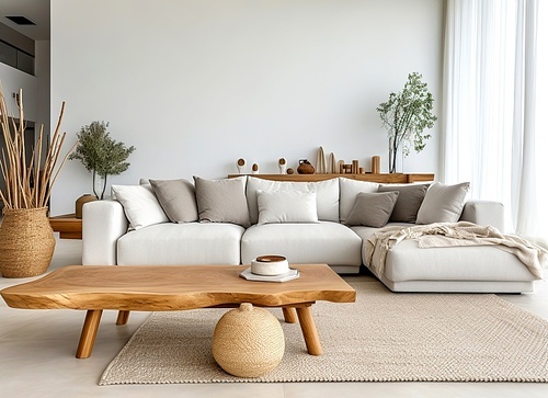 Live edge coffee table near sofa with grey pillows. Minimalist scandinavian home interior design of modern living room.