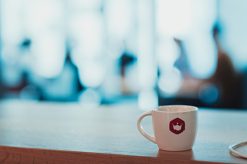 Blurred photo of young multi-ethnic business people working and communicating together in creative office. Selective focus. High-quality photo