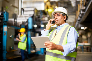 Technician controlling the work with the help of radio