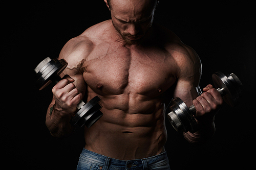 Man making exercises with dumbbells
