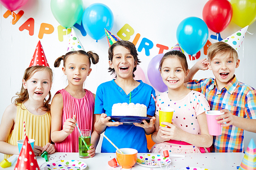 Group of happy children celebrating birthday