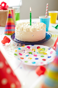 Birthday cake with one candle on the table