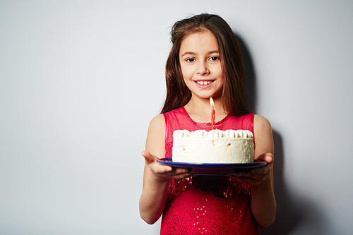 Happy girl with birthday cake 