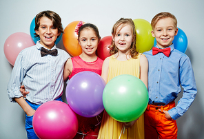 Affectionate friends with balloons  at party