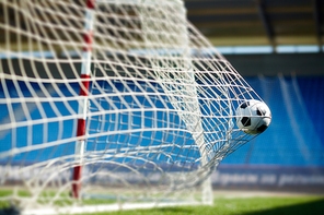 Soccer ball flying into the gate