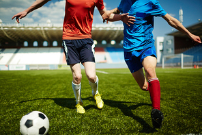 Two football players competing on the field