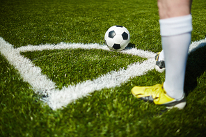 Football player going to take a corner