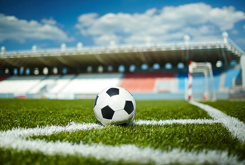 CLose-up of soccer ball in the corner of pitch