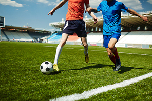 Intense fight of two football players for the ball