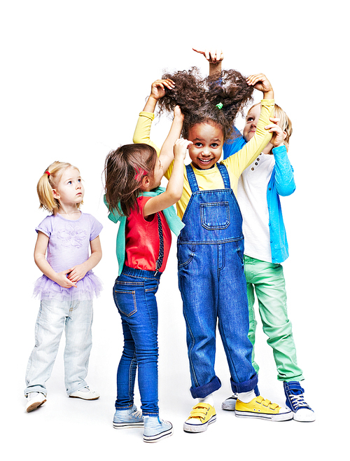 Group of children making hair to their friend