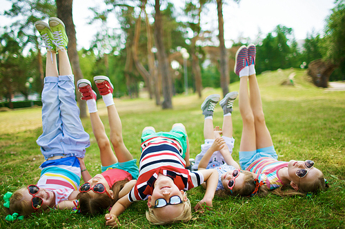 Cute children spending leisure in park