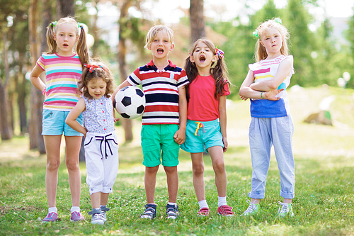 Casual kids spending leisure in park