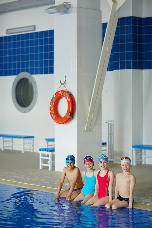 Row of cute and cheerful swimmers 