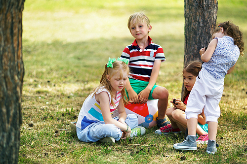 Little kids spending leisure in natural environment