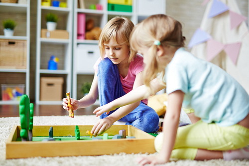 Two girls playing zoo at leisure