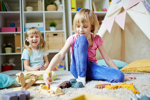 Preschool girls playing in kindergarten