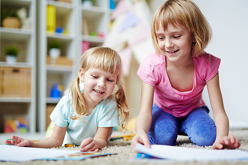 Happy kids playing together in kindergarten