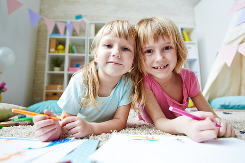 Two sisters  while drawing