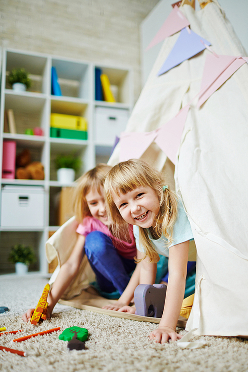 Adorable girls playing in kindergarten