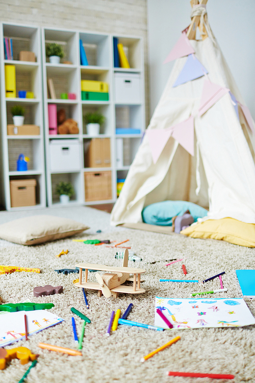 Play room in kindergarten with toys and drawing objects