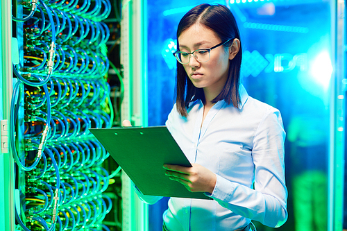 Female student inspecting connection section