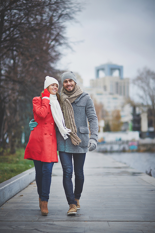 happy dates in warm clothes spending day in urban