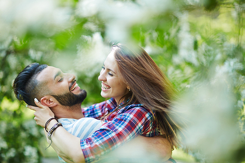 Ecstatic young couple enjoying time in park