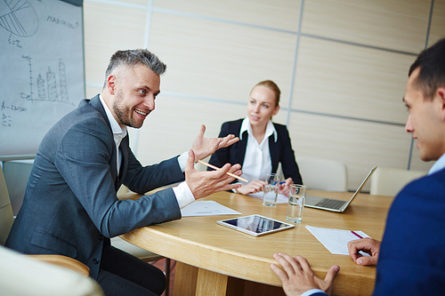 Successful employer talking to one of hiring people