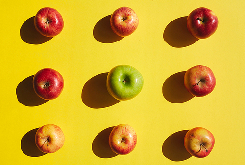 Group of apples on yellow background