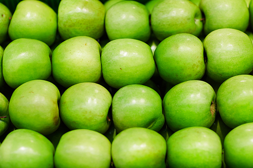 Background of granny smith apples in rows