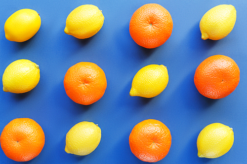 Mixed citrus fruits isolated on blue background