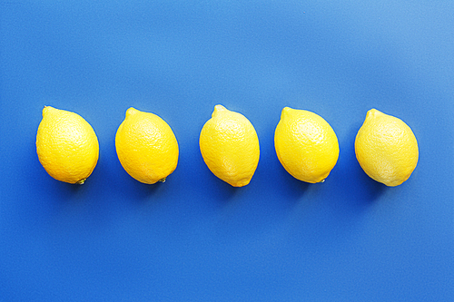 Fresh lemons in a row