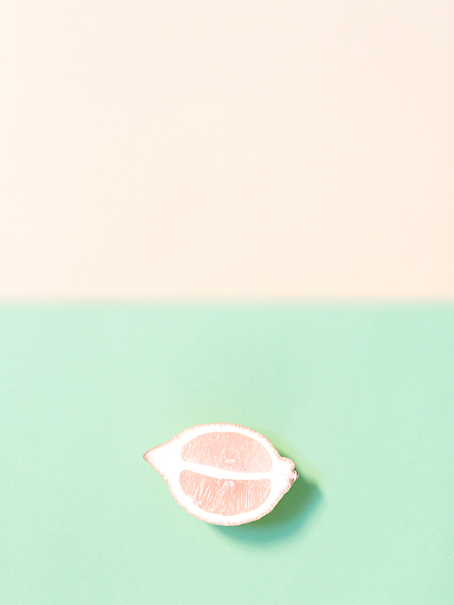 Two-color background with slice of lemon