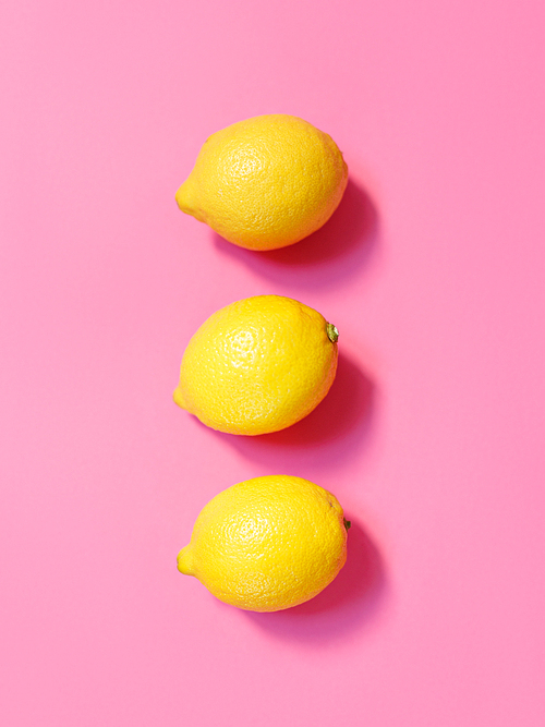 Lemons isolated on pink background