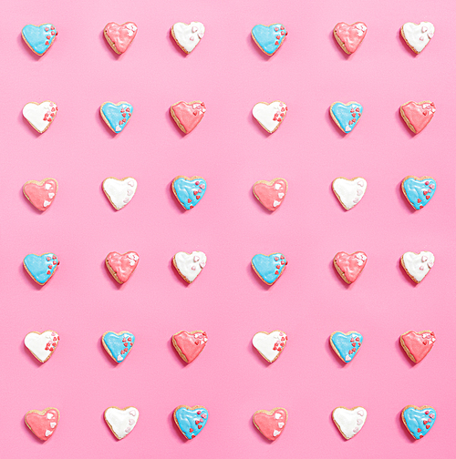 Set of heart-shaped cookies on pink background