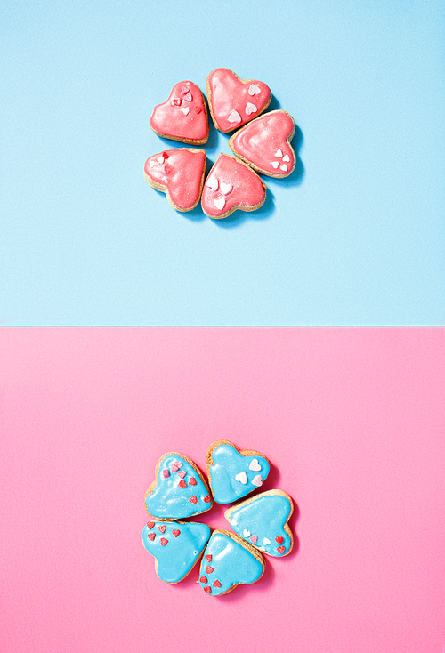Two cookie flowers on pink and blue background