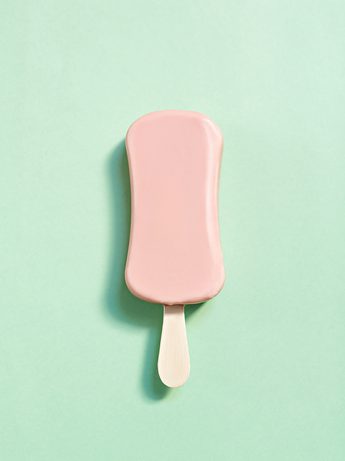 Tasty ice-cream over light green background