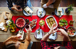 Group of friends eating festive dinner