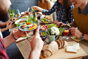 Close-up of friends talking by festive table