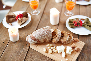 Fresh bread sliced on cutting board