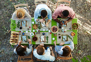 Six young friends talking by Thanksgiving dinner